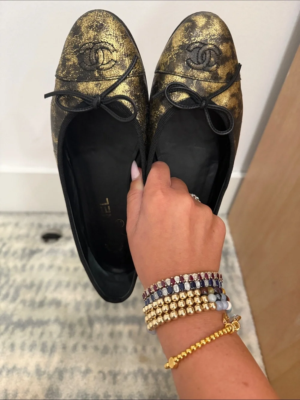 CHANEL Black and Gold Metallic Leather Ballet Flats